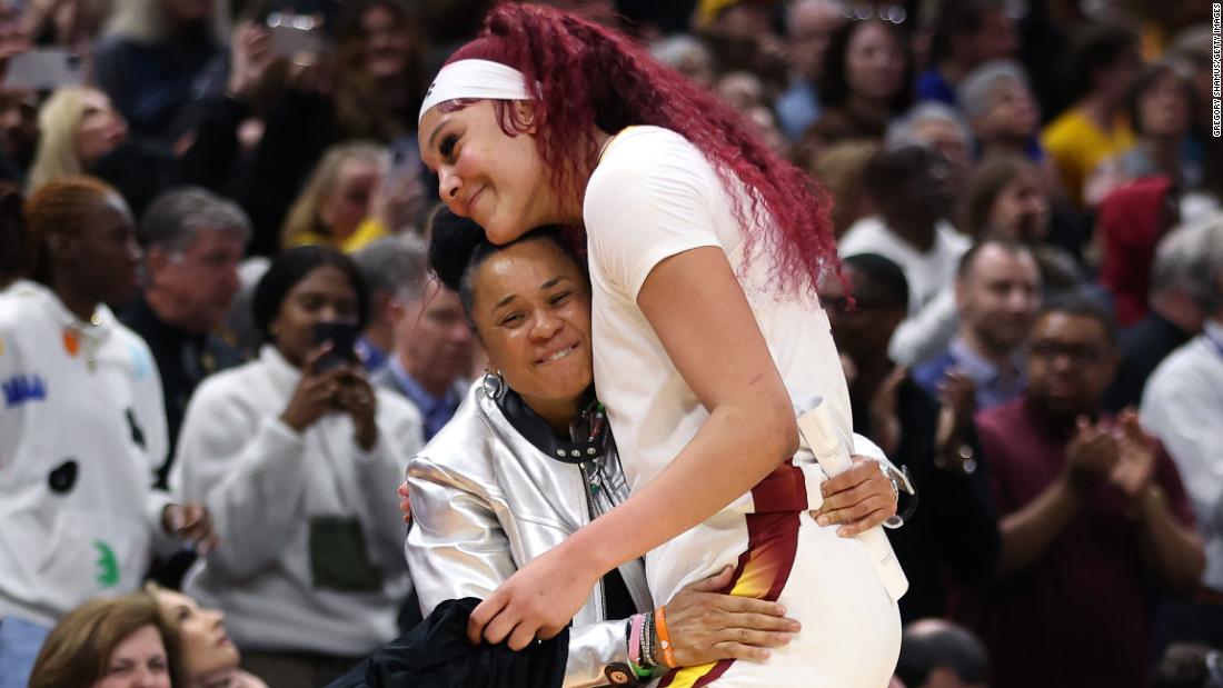 Staley hugs Kamilla Cardoso after the game.