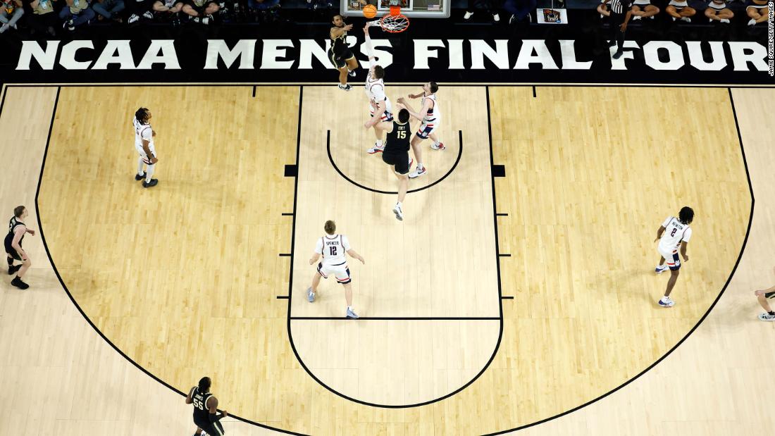 Trey Kaufman-Renn of the Purdue Boilermakers is guarded by UConn&#39;s Donovan Clingan.