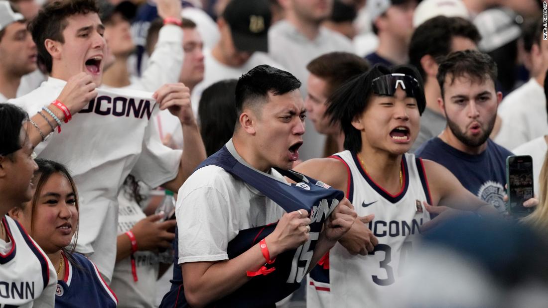 UConn fans cheer before the start of the championship game.