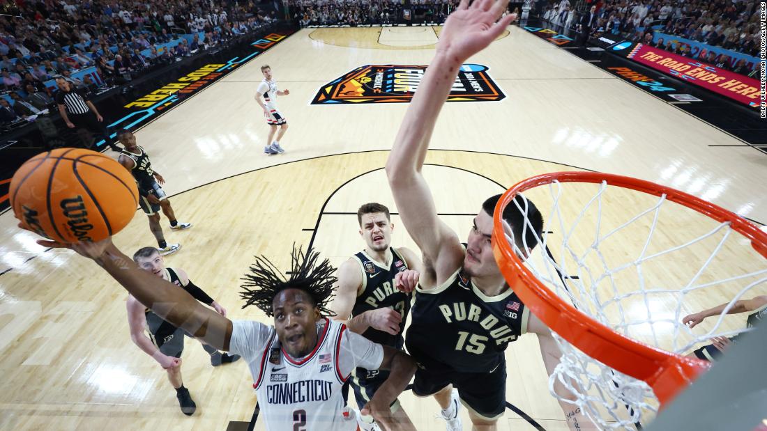 Tristen Newton of UConn is defended by Purdue&#39;s Zach Edey.