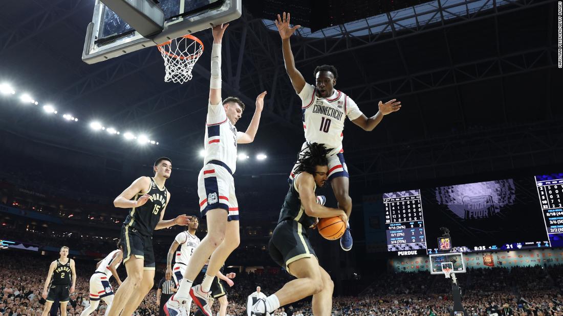 UConn&#39;s Hassan Diarra leaps above Purdue&#39;s Trey Kaufman-Renn.