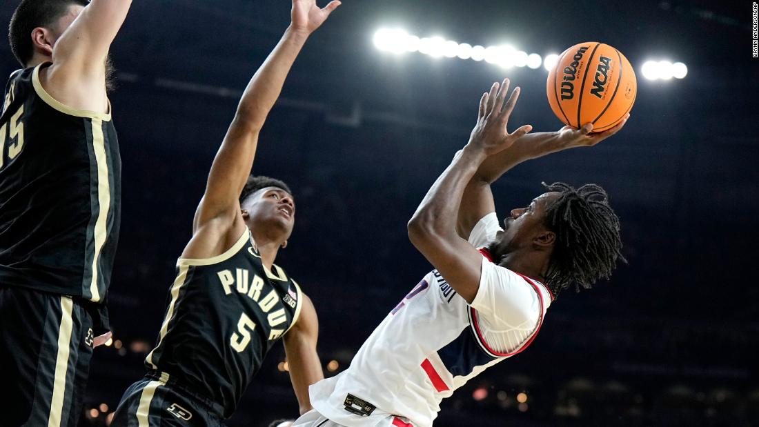 UConn&#39;s Tristen Newton takes a shot in the first half.