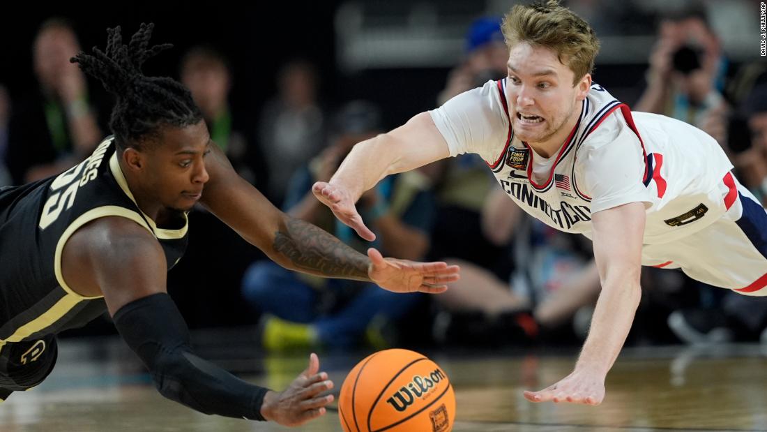 Purdue&#39;s Lance Jones vies for the ball with UConn&#39;s Cam Spencer during the second half.