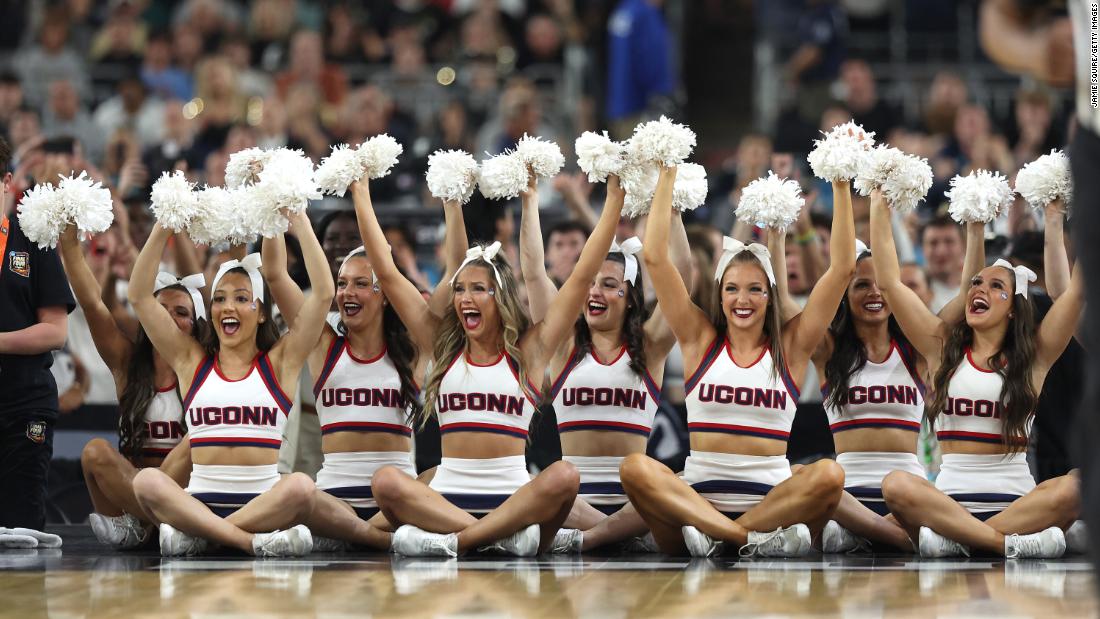 UConn cheerleaders root for their team during game.