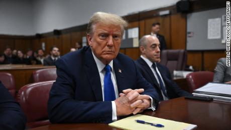 Former President Donald Trump looks on at Manhattan Criminal Court during his trial for allegedly covering up hush money payments linked to extramarital affairs in New York on April 22, 2024. 