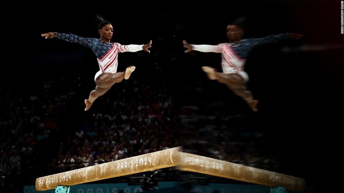 Biles competes on the balance beam during the team competition at the Paris Olympics in July 2024. &lt;a href=&quot;https://www.cnn.com/sport/live-news/paris-olympics-news-2024-07-30#h_59cd26da520c536027d9d33c35f1e04a&quot; target=&quot;_blank&quot;&gt;The Americans won gold&lt;/a&gt; for Biles&#39; eighth Olympic medal.