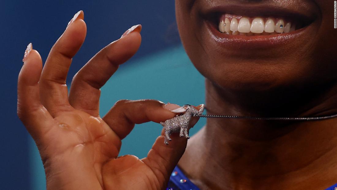 Biles shows off a goat necklace after &lt;a href=&quot;https://www.cnn.com/2024/08/01/sport/gallery/simone-biles-olympic-all-around&quot; target=&quot;_blank&quot;&gt;winning Olympic gold in the individual all-around&lt;/a&gt; in August 2024. Many consider Biles to be the GOAT: greatest of all time.